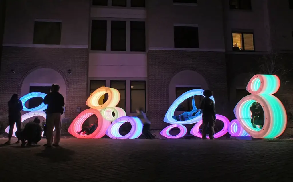 A sculptural installation in the courtyard of a student housing development at Texas State University encourages interaction.
