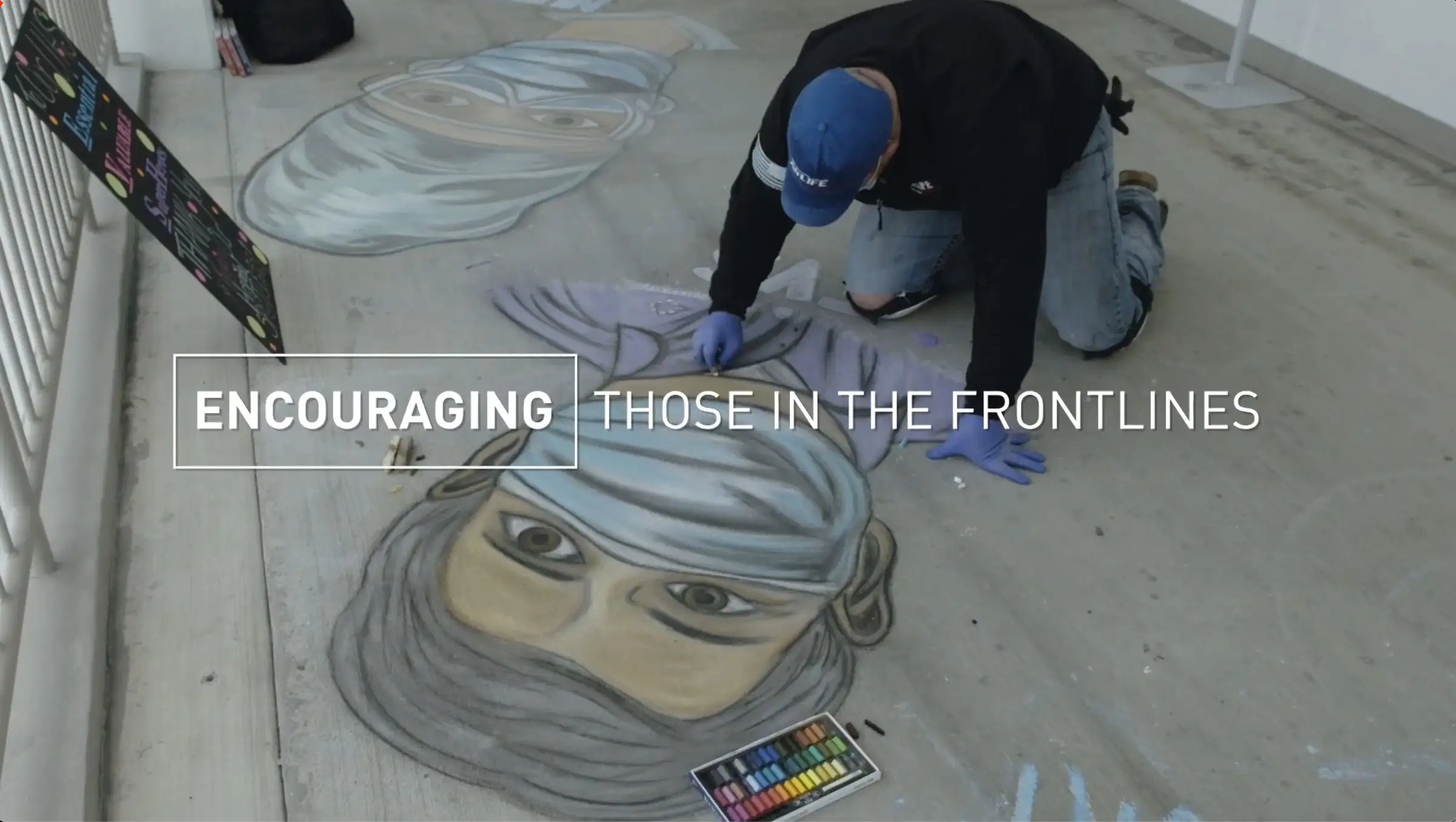 Artist creates a sidewalk mural in front of a hospital to encourage employees during the COVID-19 pandemic 