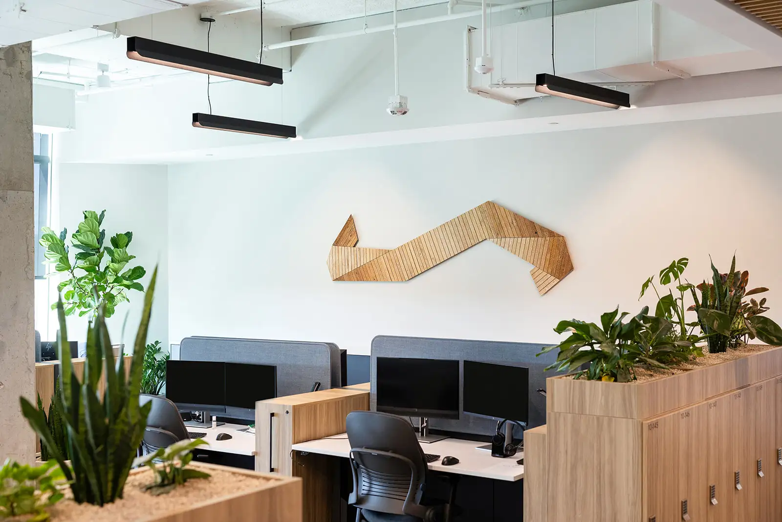 wall sculpture above employee workstation