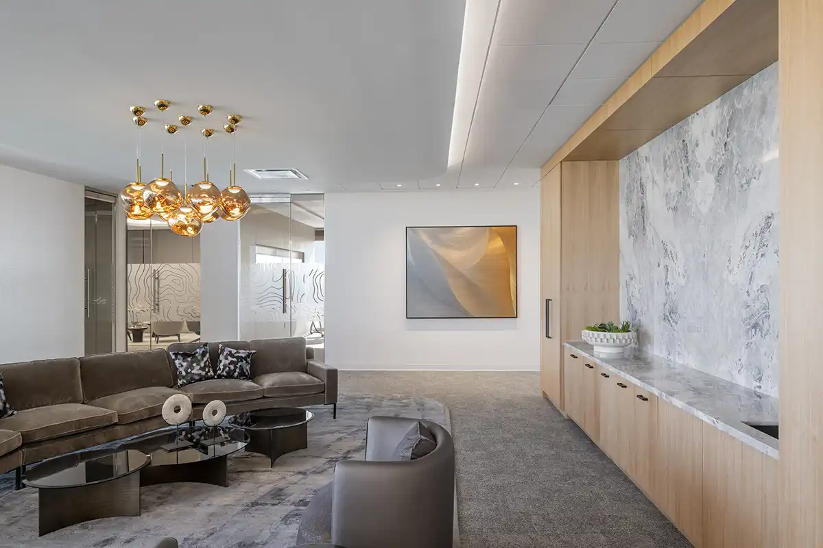 A plush seating area with fine art creates a hospitality feeling at work. 